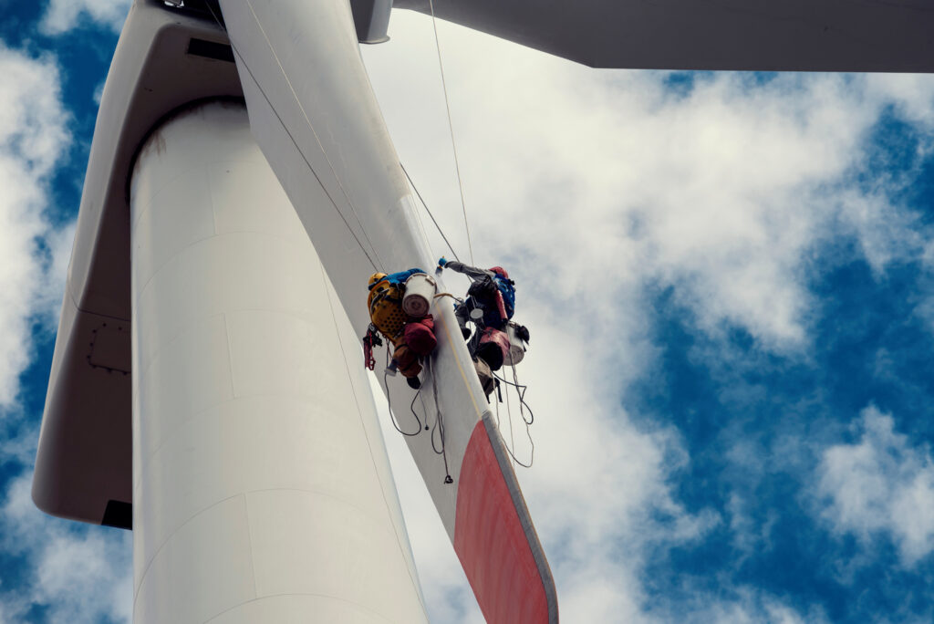 Engineer repairing and maintaining a wind turbine